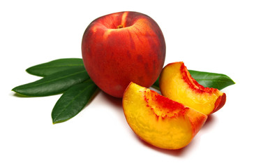 Peach with slices and leaves isolated on white