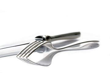 Flat lay of metallic cutlery spoon, fork, knife 