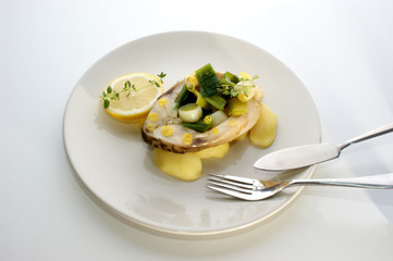 carp fillet on organic potato and lemon