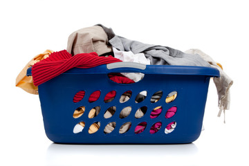 Blue laundry basket full of dirty clothes