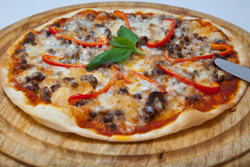 Pizza on a wooden plate