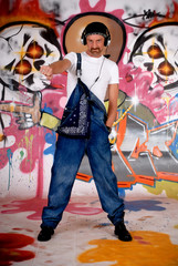 Obraz na płótnie Canvas Man headset, graffiti wall