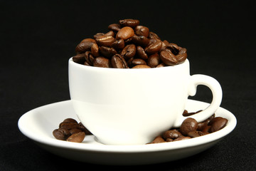 coffee time, a cup of beans on a black background