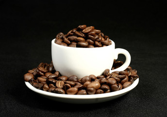 coffee time, a cup of beans on a black background