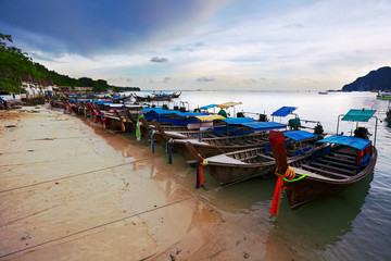 Fototapeta na wymiar Boats near the beach in evenin g time. Phi Phi island. Thailand
