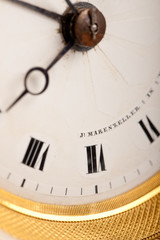 Close-up of antique white and gold clock