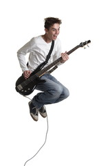 Naklejka premium The young guy with a bass guitar in a jump.