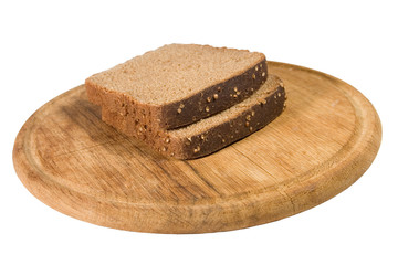 Two slices of brown bread on a wooden plate