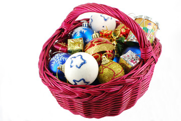 basket with Christmas ornaments isolated