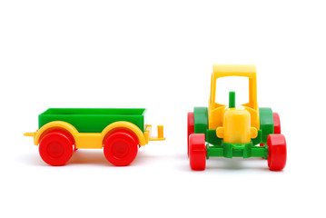 Small toy tractor isolated on white