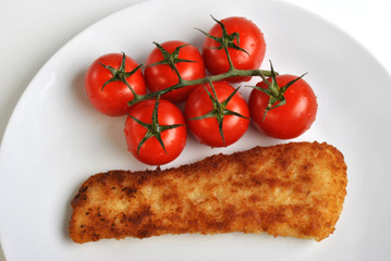 deep fried fish and some organic tomatoes