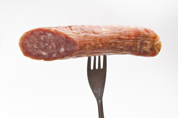 Sausage on fork