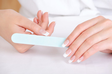Female polishing  her thumb