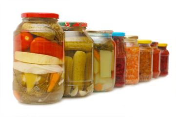 Glass jars with tinned vegetables isolated