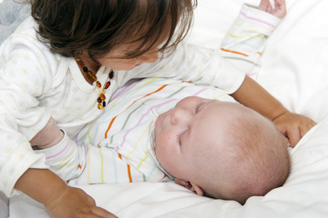 Babies playing with each other