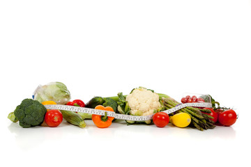 A row of vegetables on white with copy space
