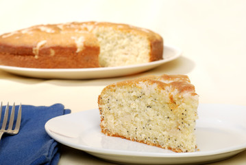 lemon poppy seed cake with napkin and fork