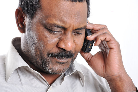 African American man speaking on phone