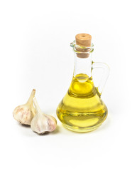 Olive or sunflower oil in bottle and garlic isolated