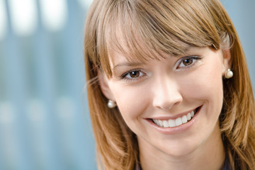 Portrait of happy businesswoman at office