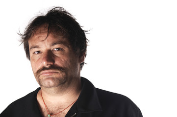 Self confident Man with stylish moustache, in a photo studio