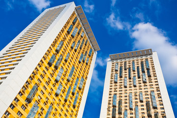 New yellow dwelling towers with balconies