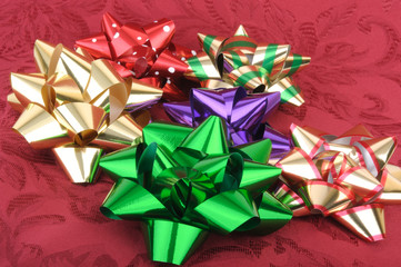 Colorful Christmas Bows on a Red Background