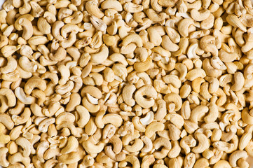 Cashew nuts arranged at the background