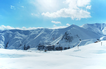 Fototapeta na wymiar High mountains under snow in the winter