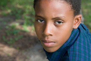 boy outdoors in plaid