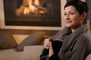 Woman at fireplace