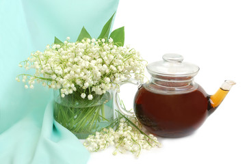 Obraz na płótnie Canvas Lily of the valley and teapot