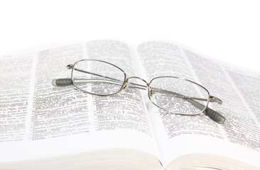 Close up of the book with glasses