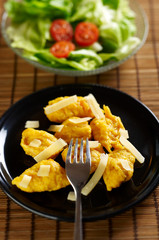 Gnocchi made of pumpkin with sliced cheese