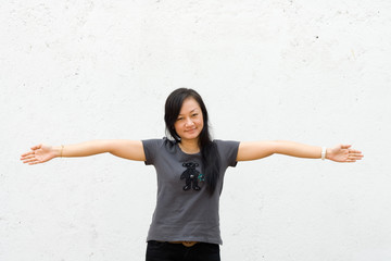 young woman spread her arms wide open
