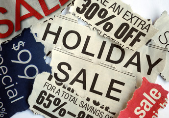 Various holiday on sale signs from the newspapers