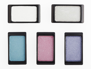 Five small multicolored eyeshadows on white with clipping paths