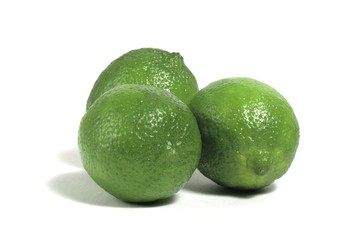 three limes isolated on white background