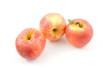 Three fresh juicy apples over white background