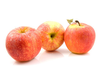 Three fresh juicy apples over white background