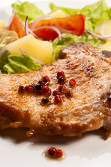 Grilled meat with boiled potatoes and vegetable salad