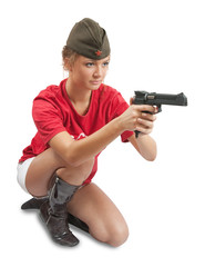 Photo of a beautiful girl in overseas cap holding gun.