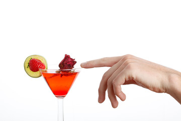 beautiful male hand touching a cocktail