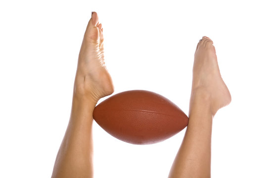 feet holding football