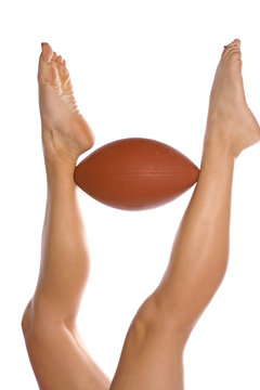 Football between womans legs