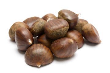 isolated brown chestnuts with a white background