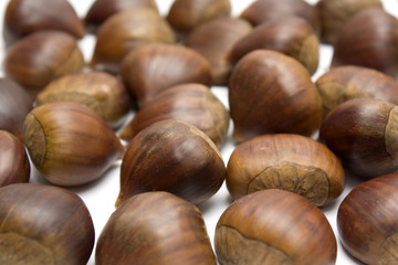 isolated brown chestnuts with a white background