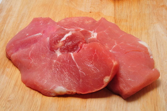 Sirloin Pork Chops on Cutting Board