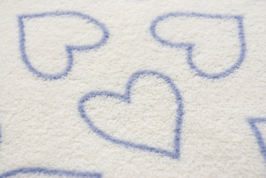 white blanket with heart shaped pattern