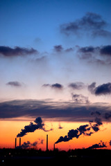 Fototapeta premium Pipes with a smoke on a decline